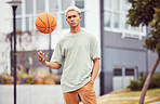 Fashion, fitness or portrait of black man with basketball in training practice, workout or exercise on city basketball court. Sports, game or male model with cool trendy clothes, Motivation or talent