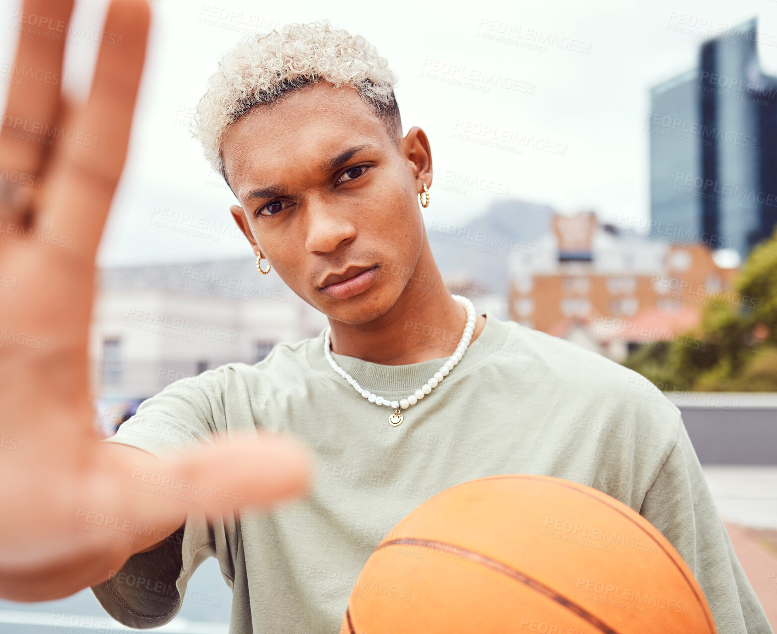 Buy stock photo Sports, selfie and basketball player with fashion with a ball standing on an outdoor court. Fitness, edgy and cool man model and athlete from Brazil posing for a picture with a casual outfit in city 