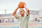 Basketball, young man and basketball player with sport in park with portrait in city and exercise outdoor. Fitness, athlete on basketball court, focus and urban with sports motivation and training.