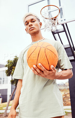 Sports, basketball court and a portrait of man with ball outside at park. Exercise, motivation and workout for fitness, wellness and health. Street game, outdoor basketball training and serious face.