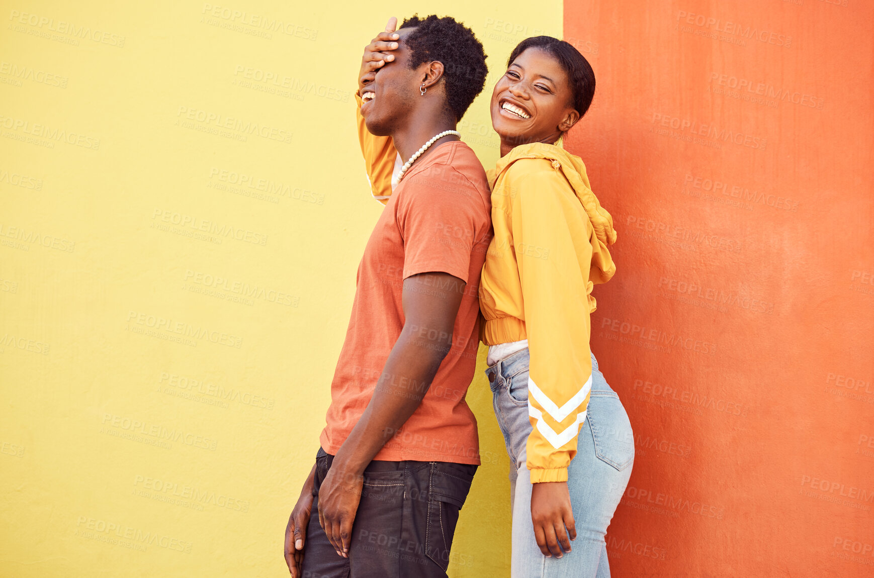 Buy stock photo Fashion portrait, people or couple of African friends relax with designer brand clothes, casual style and luxury apparel. Urban gen z aesthetic, black woman and man on orange yellow background wall