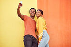 Selfie, black couple and smile with gen z youth, smartphone and influencer with post for social media against color wall background. Happy in picture, fashion mockup and tech with young man and woman