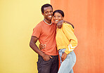 Black couple, youth and fashion with gen z, hug and together with color and portrait against wall background. Black man, black woman and young with trendy streetwear, mockup and marketing in Nigeria.
