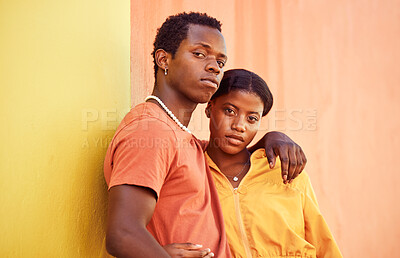 Buy stock photo Fashion portrait, people or couple of African friends relax with designer brand clothes, casual style and luxury apparel. Urban gen z aesthetic, black woman and man on orange yellow background wall