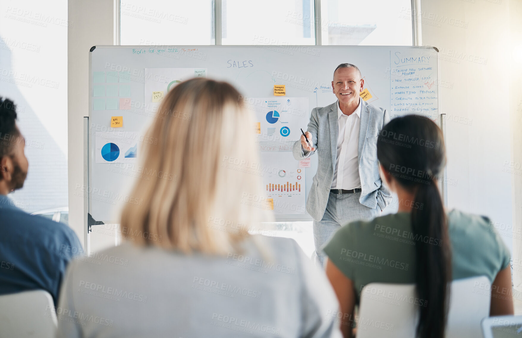 Buy stock photo Business, speaker and presentation for workshop, conference and questions. Staff, leader and man in meeting with ceo, teamwork and seminar for new process, system training and charts for sales growth
