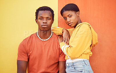 Buy stock photo Fashion portrait of African couple, people or friends relax with designer brand clothes, casual style and luxury apparel. Urban gen z aesthetic, black woman and man on orange yellow background wall