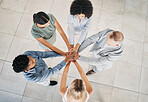 Office, business people and top view of a stack of hands for celebration, motivation or team building. Collaboration, diversity and overhead of a corporate team cheering for teamwork in the workplace