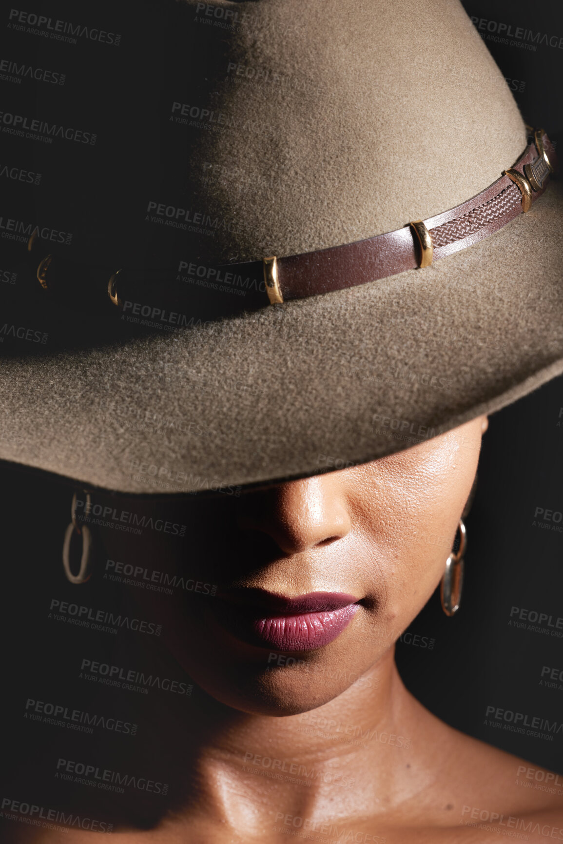 Buy stock photo Woman, dark studio and hat for fashion, beauty and mystery with style, design or closeup headshot. Girl, model and black background for fantasy, night aesthetic or makeup for edgy, sexy woman and art