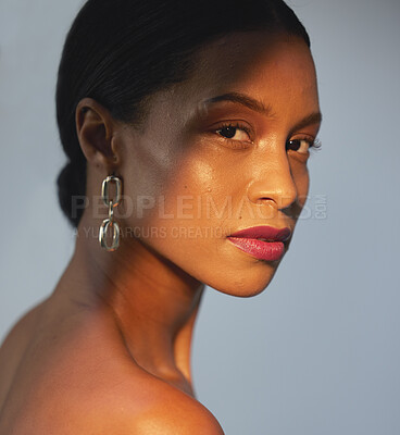 Buy stock photo Portrait, beauty and skincare with a model black woman in studio on a gray background for natural care. Face, cosmetics and wellness with an attractive young female posing to promote a luxury product