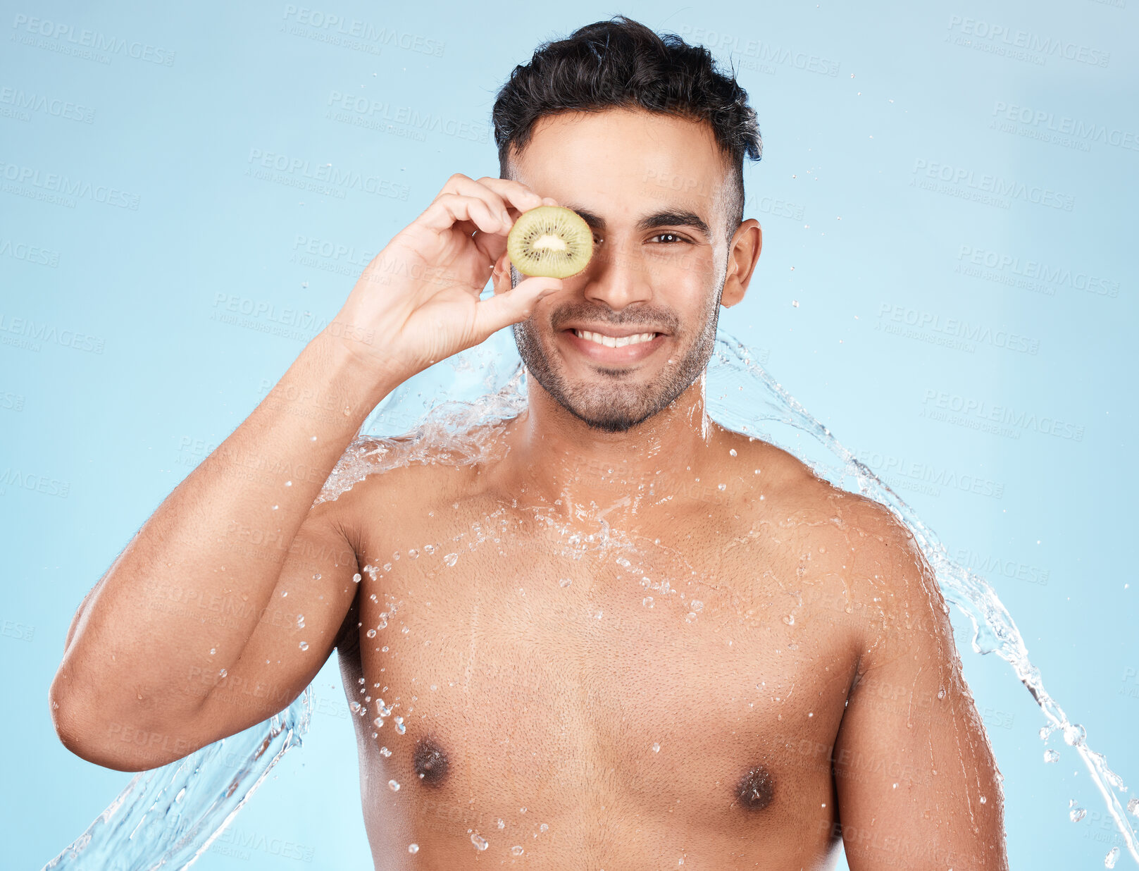 Buy stock photo Skincare, beauty and water splash, man with kiwi for vitamin c facial detox for healthcare, natural healthy skin and smile. Water, wellness and sustainability, organic luxury cleaning and grooming.