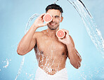 Skincare, beauty and water splash, man with fruit for vitamin c facial detox for healthcare, natural healthy skin and smile. Water, wellness and sustainability, organic luxury cleaning and grooming.