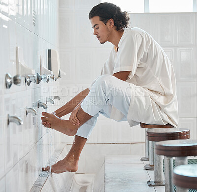 Buy stock photo Muslim, water and man cleaning feet for ablution, wudu or spiritual purification hygiene for Islamic religion, worship or moslem culture. Indonesia mosque, Islam faith and profile of man washing foot