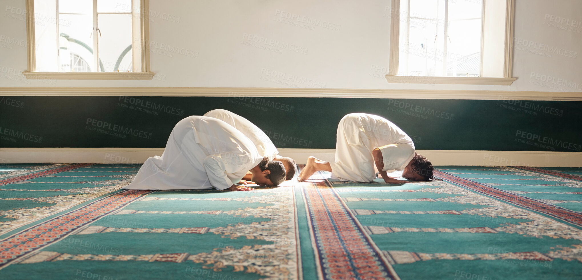Buy stock photo Muslim, prayer and mosque with a spiritual man group praying together during fajr, dhuhr or asr, otherwise maghrib or isha'a. Salah, worship and pray with islamic friends observing ramadan tradition