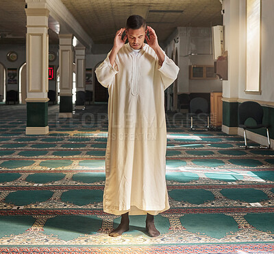 Buy stock photo Muslim, prayer or man in a mosque praying to Allah for spiritual mindfulness, support or wellness in Doha, Qatar. Religion, peace or Islamic person in temple to worship or praise God with gratitude