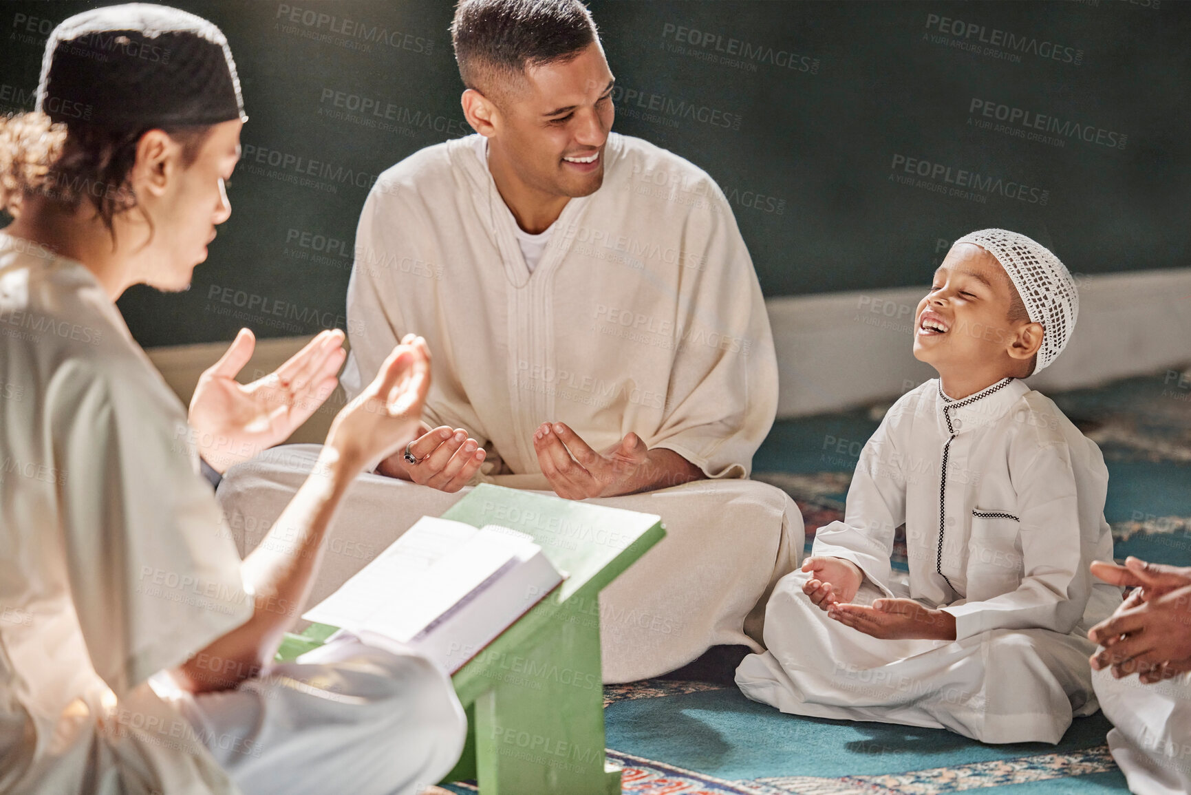 Buy stock photo Muslim child, mosque and quran with teacher for spiritual learning, development or growth on carpet. Islamic teaching, man and boy for holy worship, book or reading for faith, islam or study in Qatar