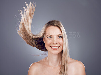 Buy stock photo Portrait, beauty and hair with a model woman in studio on a gray background for keratin treatment or natural haircare. Face, skincare and wellness with a female posing to promote a haircare product