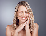 Portrait, beauty and hair with a model woman in studio on a gray background for keratin treatment or natural haircare. Face, skincare and wellness with a female posing to promote a haircare product