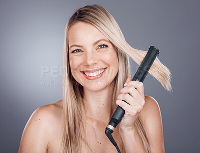Buy stock photo Woman, hair care portrait and flat iron with smile, beauty and happiness with self love by studio background. Model, hair and self care grooming with straightener for hairstyle aesthetic by backdrop
