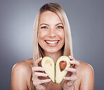 Skincare, beauty and portrait of woman with avocado in studio for wellness, vitamins and luxury spa. Dermatology, makeup and girl marketing organic, healthy and natural cosmetics for facial treatment
