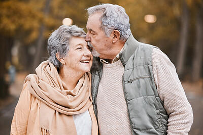 Buy stock photo Love, kiss and senior couple in park enjoying weekend, quality time and romantic bonding together. Retirement, relationship and elderly man and woman walking, hugging and embrace outdoors in nature