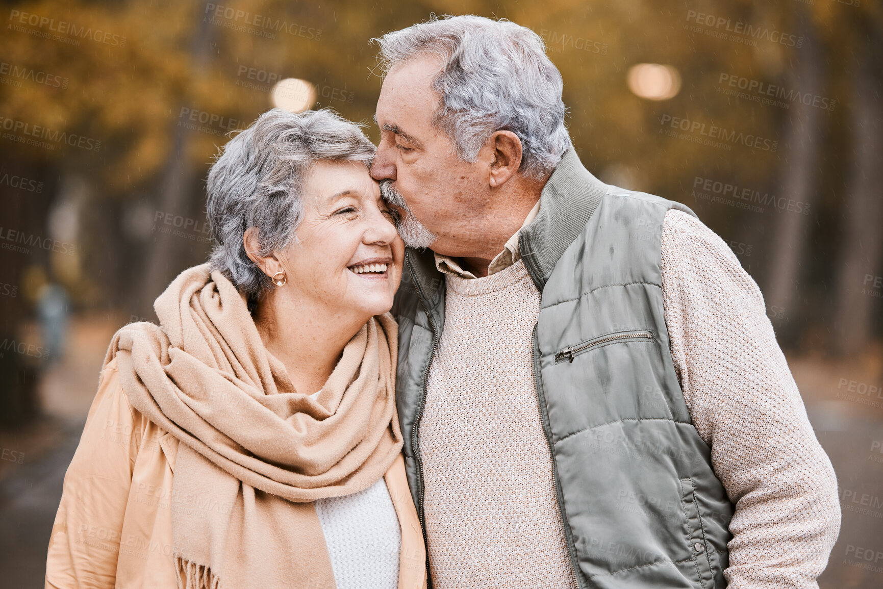 Buy stock photo Love, kiss and senior couple in park enjoying weekend, quality time and romantic bonding together. Retirement, relationship and elderly man and woman walking, hugging and embrace outdoors in nature