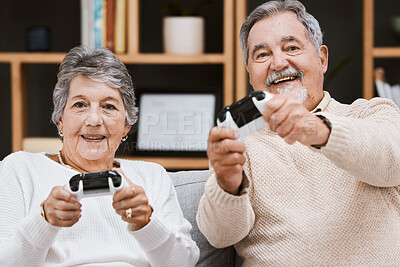 Buy stock photo Video game, portrait and senior couple on sofa relaxing, bonding and gaming together in living room. Happy, fun and elderly man and woman gamers in retirement playing online for entertainment at home