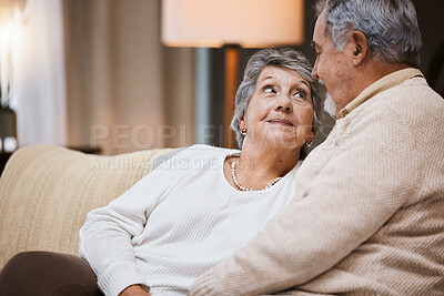Buy stock photo Love, sofa and senior couple talking, marriage and bonding for relationship, retirement and romance. Romantic, elderly man and mature woman in living room, conversation and relax on weekend break.