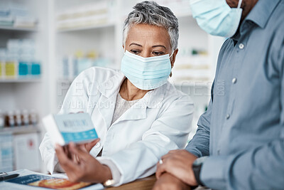 Buy stock photo Covid, pharmacy and woman with box consulting patient on prescription, medication or medicine. Corona, healthcare and senior female medical professional showing black man health product in drug store