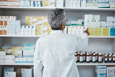 Buy stock photo Pharmacy pills, pointing and senior pharmacist with product choice, medicine box or pharmaceutical medication drugs. Retail medical store, healthcare and back of elderly woman point at shop shelf