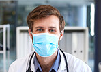 Portrait, man and doctor with covid face mask in hospital for medical safety, healthcare risk and clinic analysis in Australia. Face, male surgeon and corona virus expert, ppe compliance and medicine