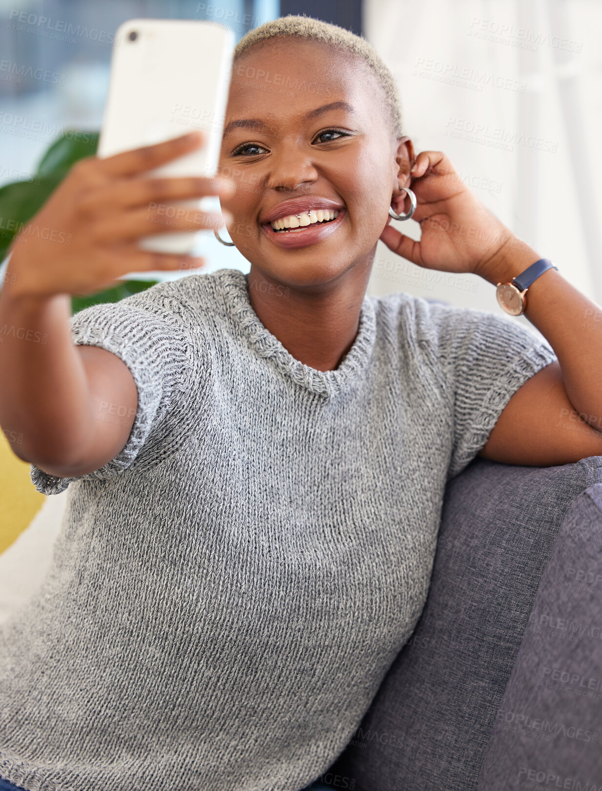 Buy stock photo Black woman, selfie and smile on sofa for social media, beauty and happy in home living room. Influencer woman, happiness and relax on couch for social network picture, smartphone and communication