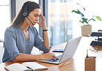 Call center, stress and tired woman working on laptop with headache, burnout and depression consulting at CRM desk. Female with anxiety mental health problem at customer service telemarketing office