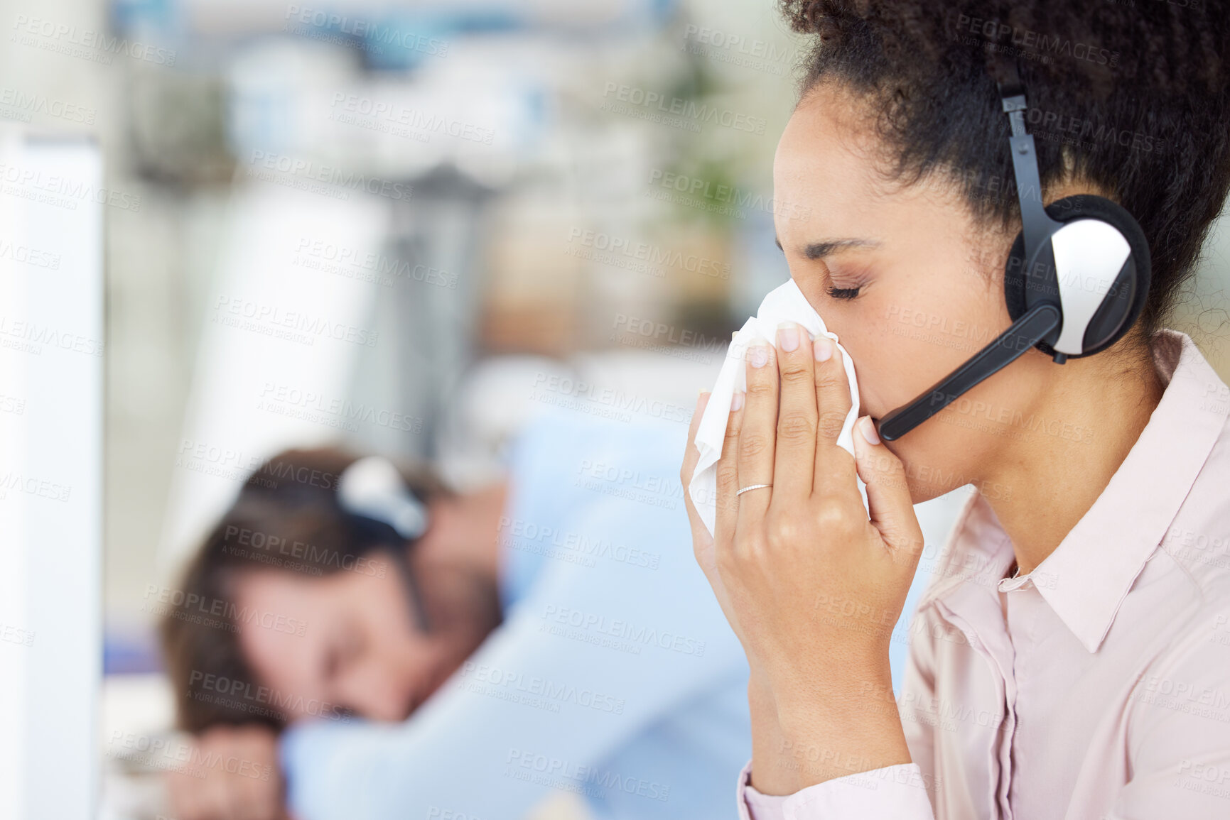 Buy stock photo Customer service, call center and sick woman blowing nose in office workplace. Covid, cold and black female telemarketing employee, sales agent or consultant with tissue for flu, corona or covid 19.