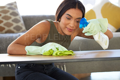 Buy stock photo Woman, cleaning service and spraying living room table for bacteria, dust and dirt for health, wellness and safety in house or apartment. Happy cleaner with cloth and chemical liquid bottle to clean