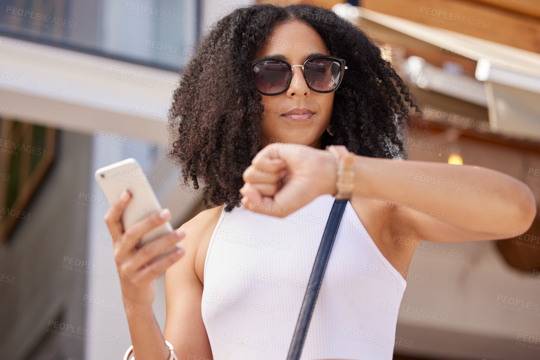 Buy stock photo Time, watch and smartphone of woman in city for summer shopping sale, discount or promotion marketing with online website. Black woman outdoor on cellphone waiting for promo on retail, ecommerce app
