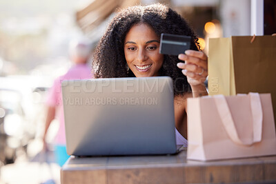 Buy stock photo Credit card, laptop and woman in city online shopping, e commerce and fintech for fashion marketing, advertising and promotion sales. Black woman on digital e commerce website for finance banking app