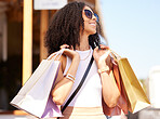 Happy young woman, shopping bags or retail city fashion for luxury clothes, self care spree or luxury mall sales. Smile, fun or trendy customer gifts in Brazilian urban street or relax street market