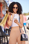Black woman with smartphone, shopping bag and mobile app with technology and communication, call for transport service at shopping mall. Shopping, fashion and retail with internet and 5g network.