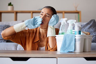 Buy stock photo Cleaning, yawn and tired with a woman housekeeper yawning while working in a home as a cleaner. Clean, bored and hygiene with a female suffering burnout from housekeeping as a maid with disinfectant