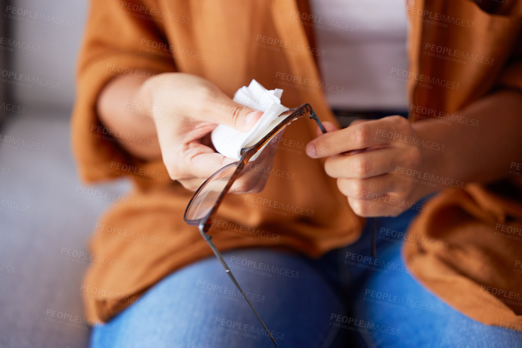 Buy stock photo Woman cleaning glasses for dust, dirt and eye care protection with fabric tissue. Closeup female hands, microfiber cloth and spectacles, frames and eyewear for clear vision and optic lens maintenance