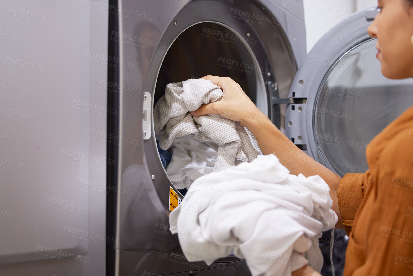 Buy stock photo Laundry, cleaning and woman with clothes in the washing machine for housekeeping, clean fabric and home spring cleaning. Service, clean and cleaner at a laundromat for morning housework routine