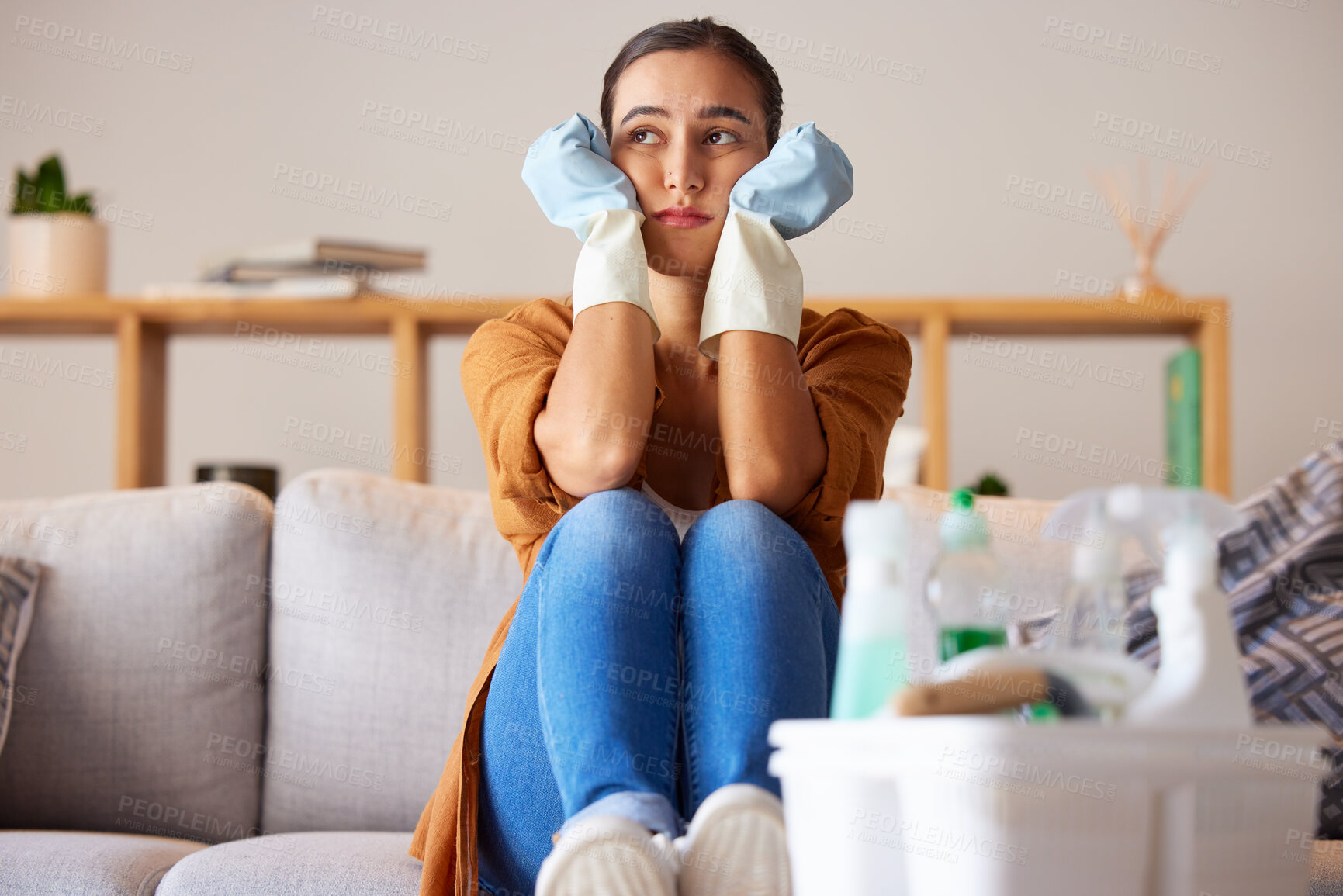 Buy stock photo Tired, sad and woman cleaning home overwhelmed, stressed and moody thinking of tasks. Spring cleaning fatigue of young girl thoughtful in house living room with  cleaner hygiene products