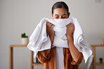 Laundry, fresh and woman smelling a towel after cleaning, housework and washing clothes in the morning. Chores, housekeeping and cleaner with smell of clean clothing after a routine wash at home