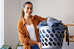 Cleaning, laundry and portrait of woman in living room for housekeeping, hygiene or sanitary. Fabric, clothes and tidy with girl cleaner and basket at home for hospitality, domestic or chores routine