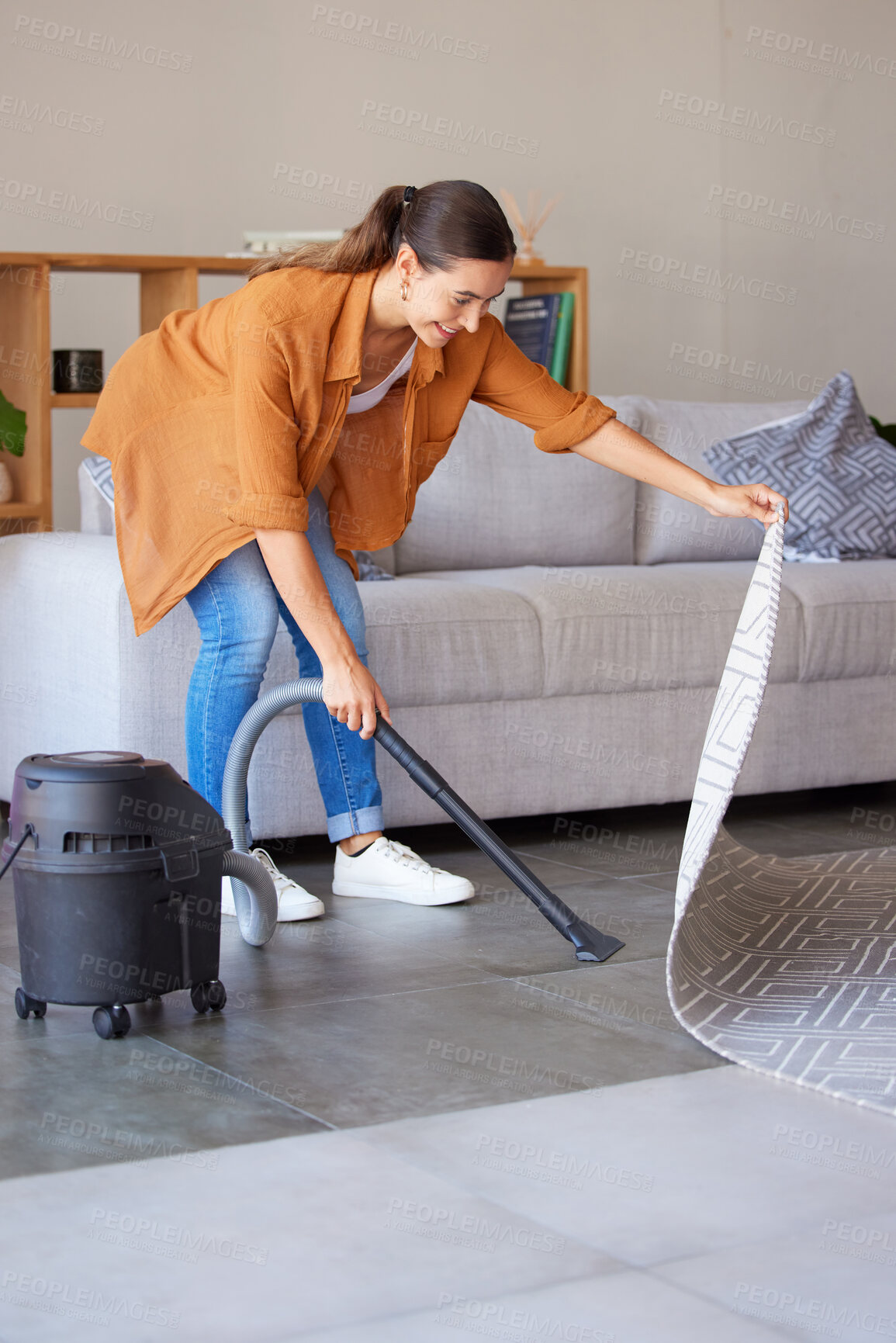 Buy stock photo Cleaning, housekeeping and woman vacuum cleaner for floor in living room for dirt, dust and hygiene in home. Cleaning service, domestic housework and girl with electric appliance for lounge flooring