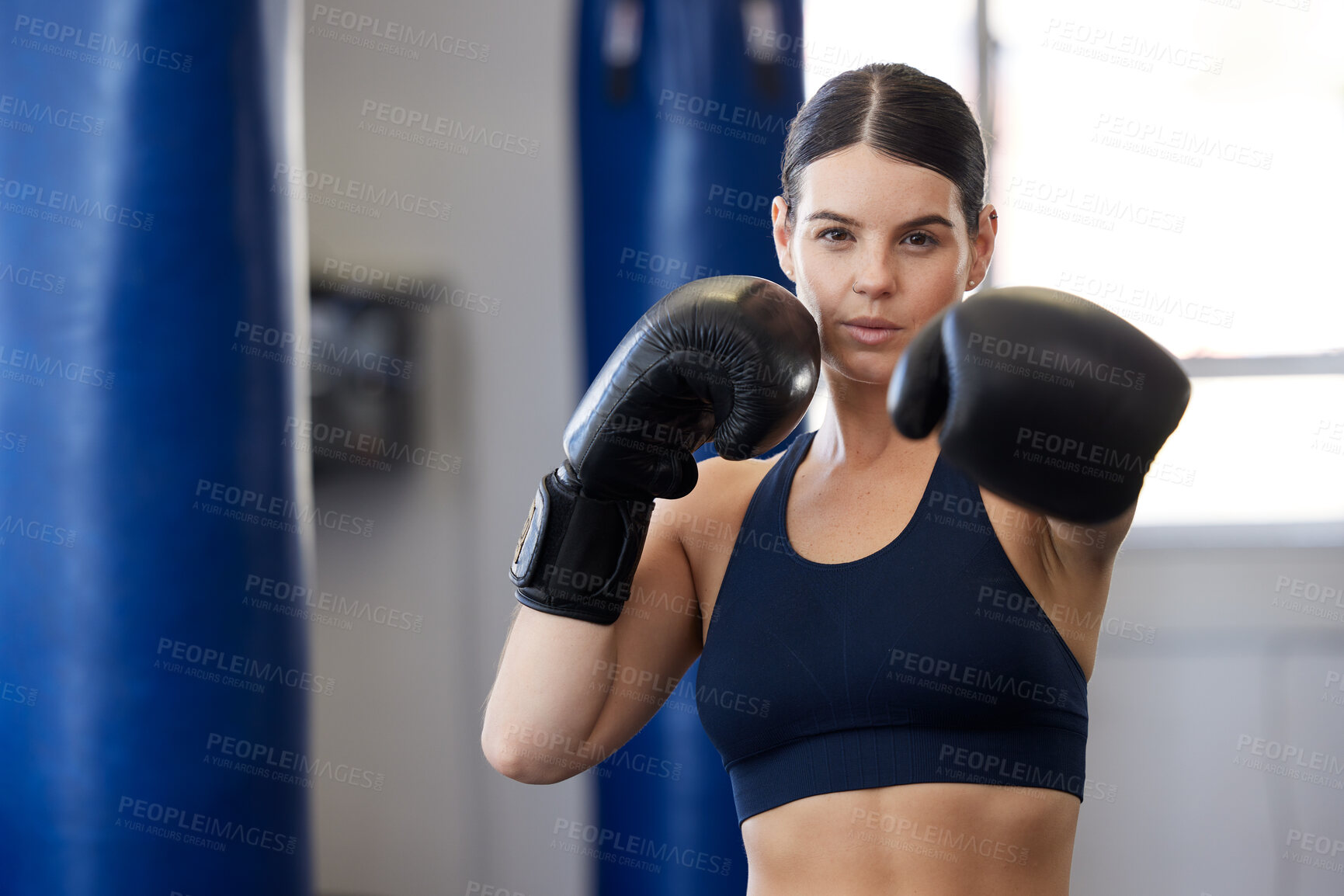 Buy stock photo Fitness, kickboxing and portrait of woman athlete doing a cardio workout while training for a match. Sports, exercise and female boxer getting ready for a fight in sport, wellness and health gym.