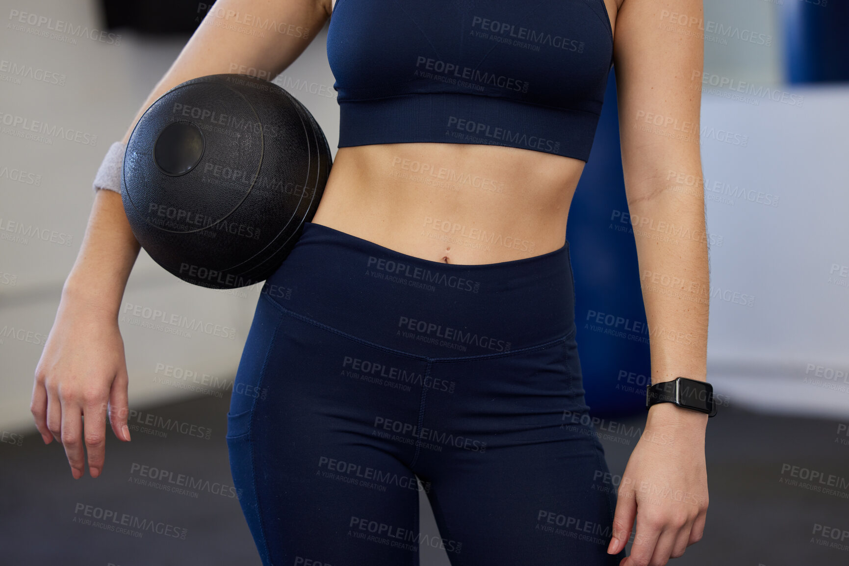 Buy stock photo Fitness, ball and slim woman in the gym for a wellness, health and strength workout or training. Sports, healthy and closeup of a female model body with sport equipment for exercise in a gymnasium.