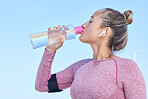 Woman runner, water bottle and music with earphones for focus, workout and outdoor training for health. Girl, wellness and hydration for running, exercise or streaming audio in summer for strong body