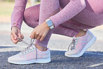 Woman, shoes lace and fitness run outdoor for cardio training workout, sports exercise and runner sneakers wellness in street. Running marathon, ready and feet zoom or sportswear shoe check in city