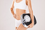Weight loss, fitness and body of woman with scale in studio for wellness, body care and healthy lifestyle. Nutrition, diet and torso of girl in underwear for balance in training, exercise and workout